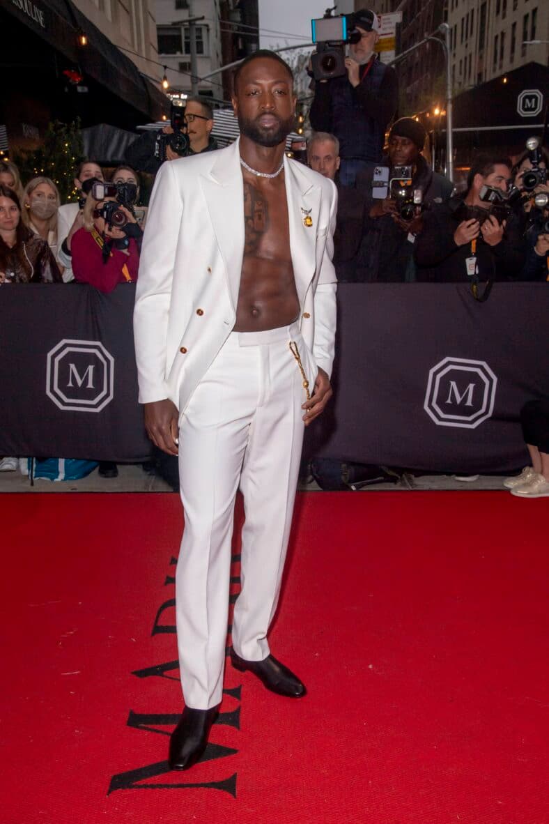 Dwyane Wade wearing a white suit. 