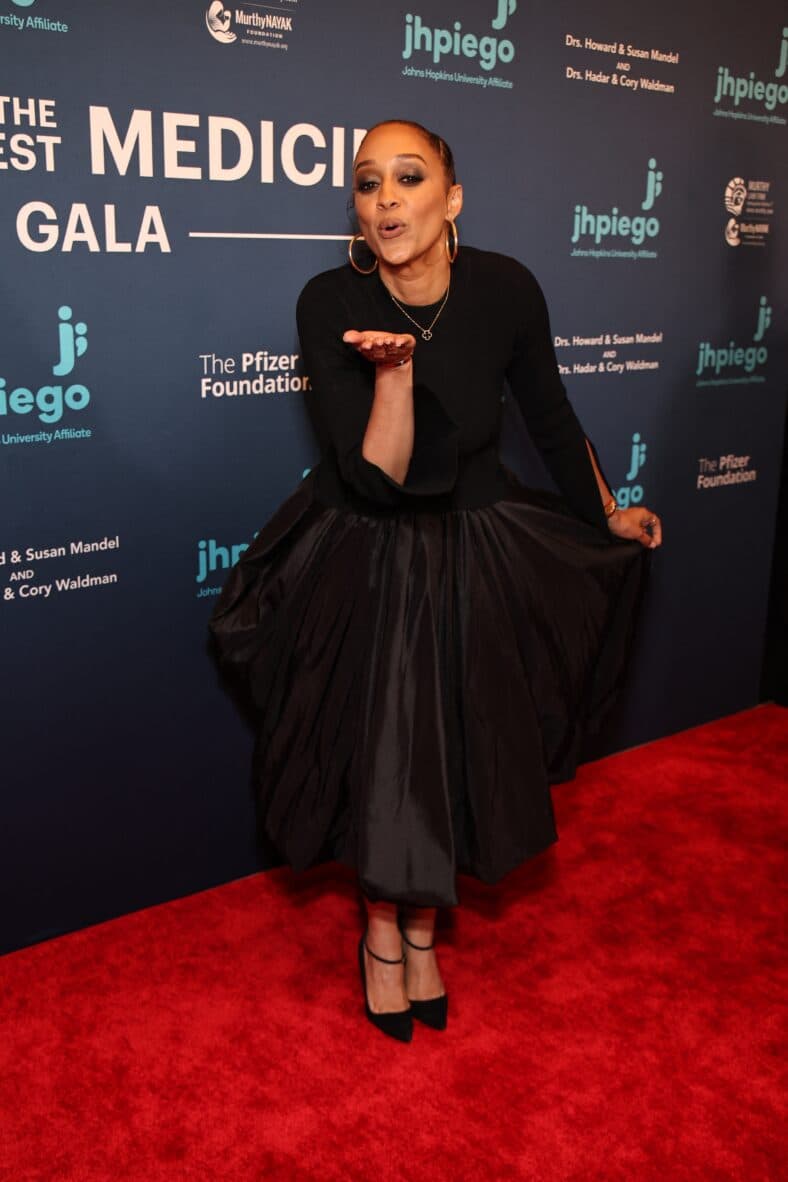 Tia Mowry posing on the red carpet. 