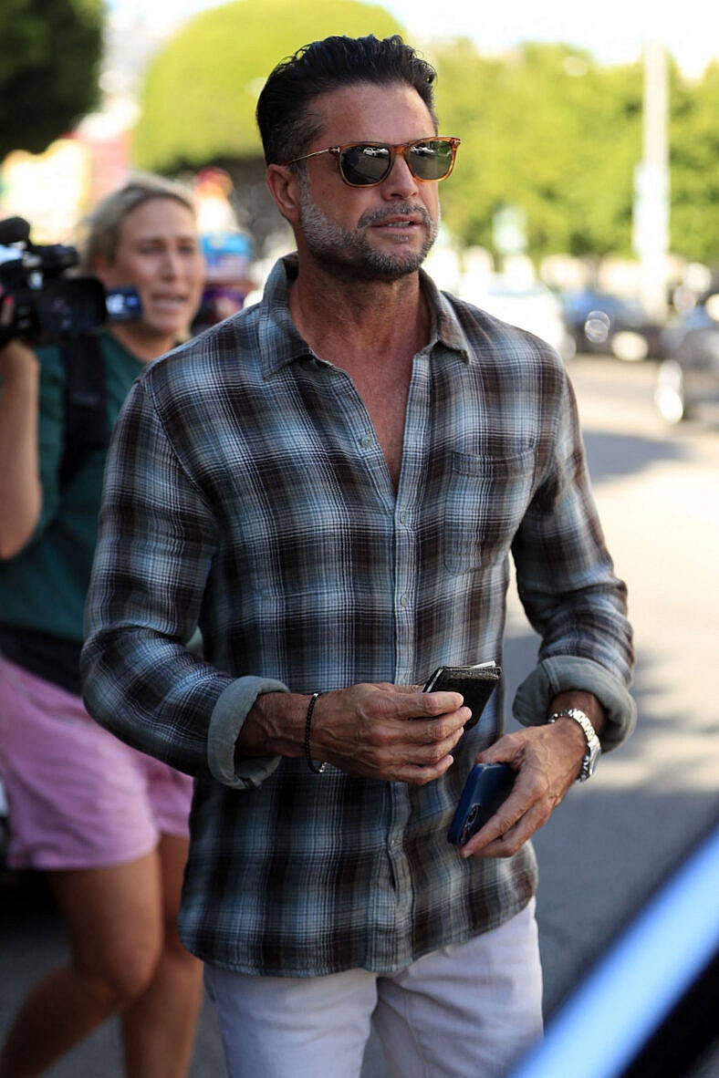 David Charvet is seen leaving the Ivy in Beverly Hills with a female friend, The 50 year old former Baywatch heart throb still looks good after having lunch at the world famous Ivy.