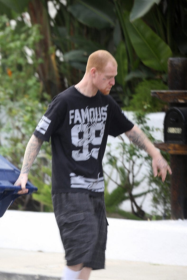 Redmond O'Neal looks tough while taking trash out Ryan O'Neal's house in Malibu.