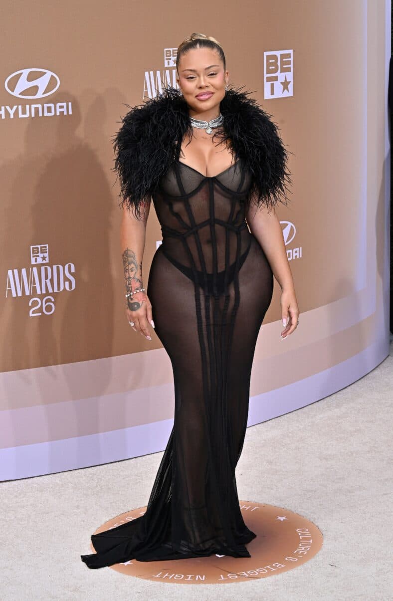 Latto posing in a sheer black gown 