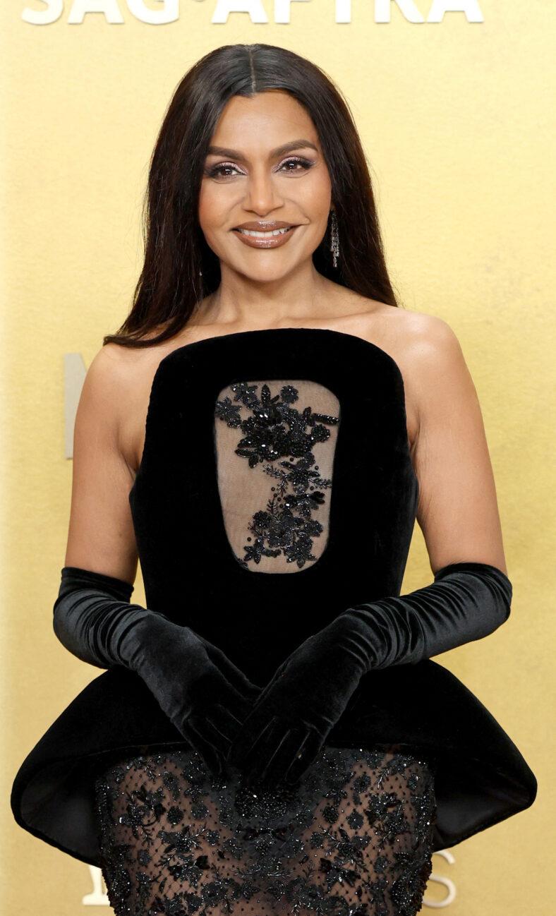 Mindy Kaling posing on the red carpet.