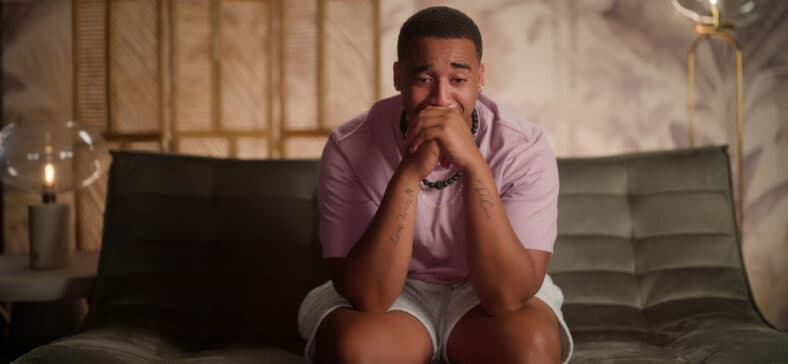 Picture of a man appearing to cry during "Temptation Island" season 2.
