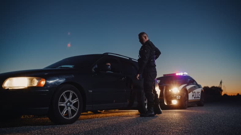 Police officer pulling over a vehicle.