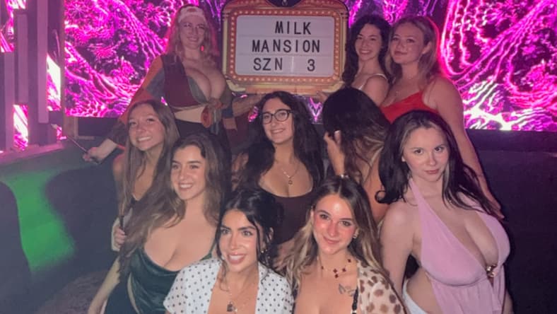 Group of women posing together at a club.