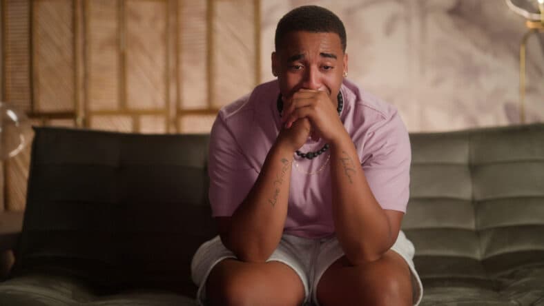 Picture of a man appearing to cry during "Temptation Island" season 2.