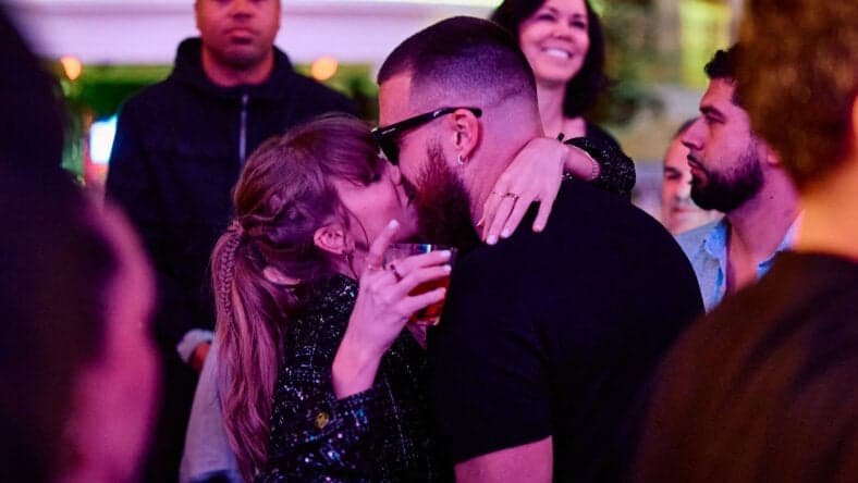 Taylor Swift and Travis Kelce share a kiss at XS Nightclub as Kansas City Chiefs celebrate Super Bowl win