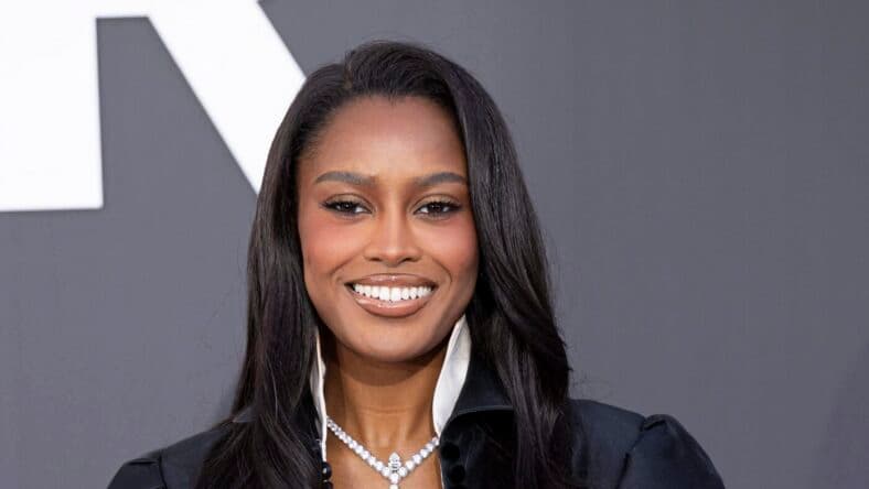 Ciara Miller posing on the red carpet.