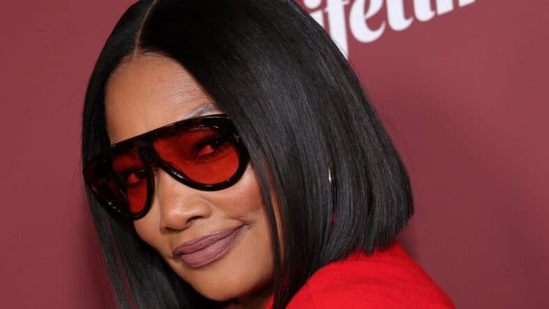 Garcelle Beauvais posting on the red carpet.