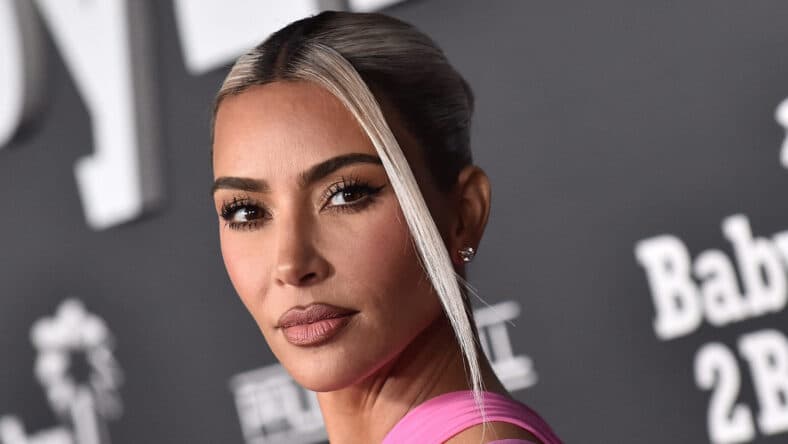 Kim Kardashian posing on the red carpet.