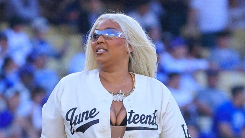 Lizzo throwing first pitch at Dodgets game.