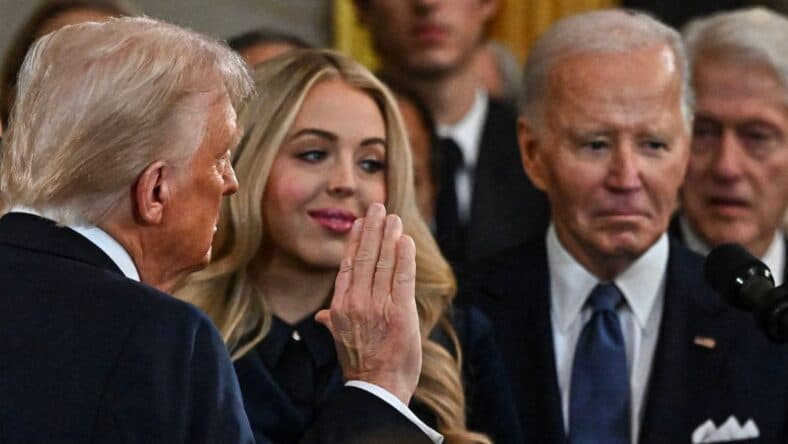 Joe Biden looks on as Donald Trump is sworn in
