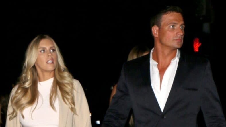 Ryan Lochte posing with wife.