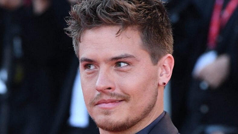 Dylan Sprouse posing on the red carpet.