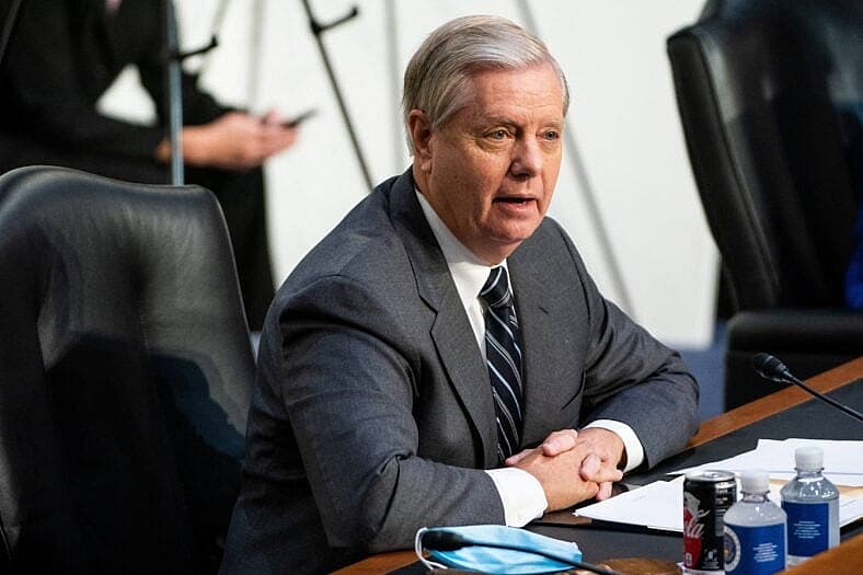 United States Senator Lindsey Graham (Republican of South Carolina) listens as Loretta Lynch, United States Attorney For The Eastern District Of New York,