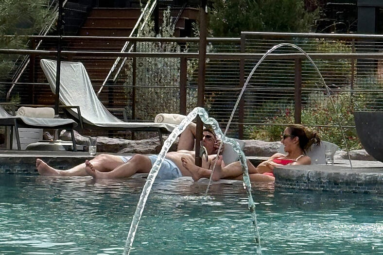 Dianna Russini and Mike Vrabel poolside.