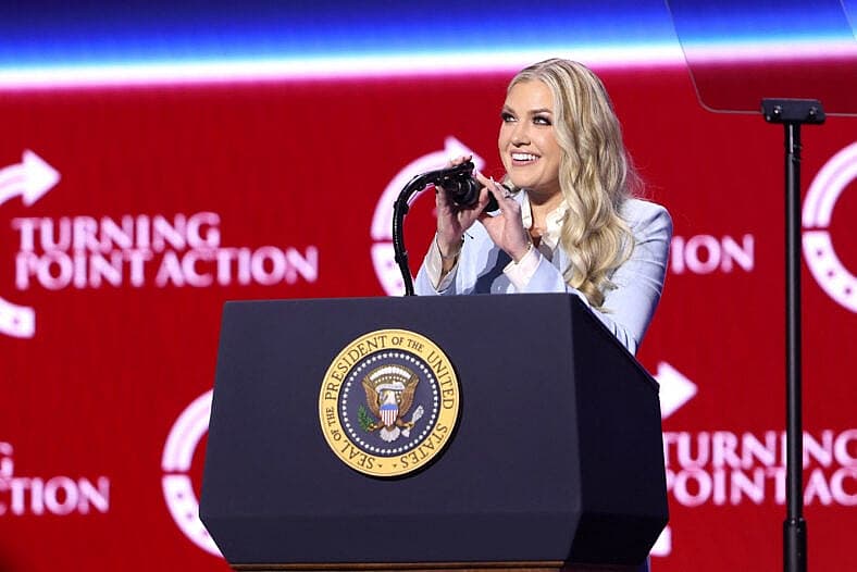 Erika Kirk speaks at a podium