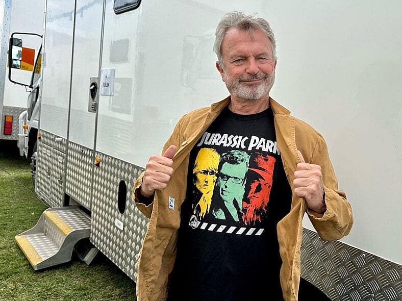 Jurassic Park stars Sam Neill, Laura Dern and Jeff Goldblum model new clothing collection celebrating dinosaur blockbusters 30th anniversary