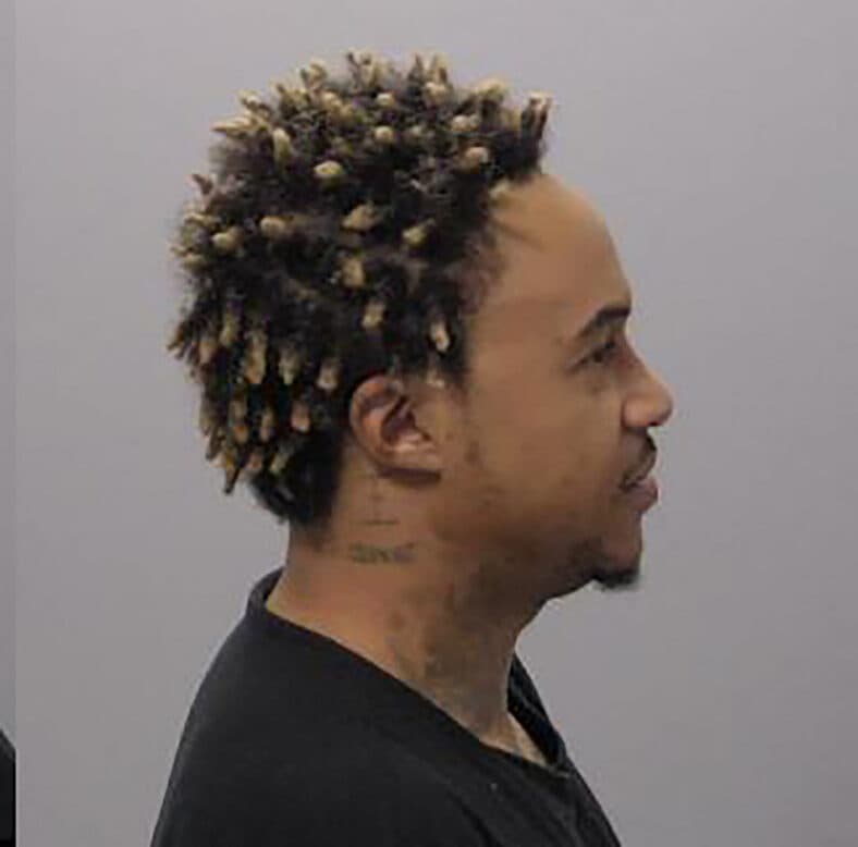 Thats So Raven star Orlando Brown grins after being arrested on domestic violence charge.