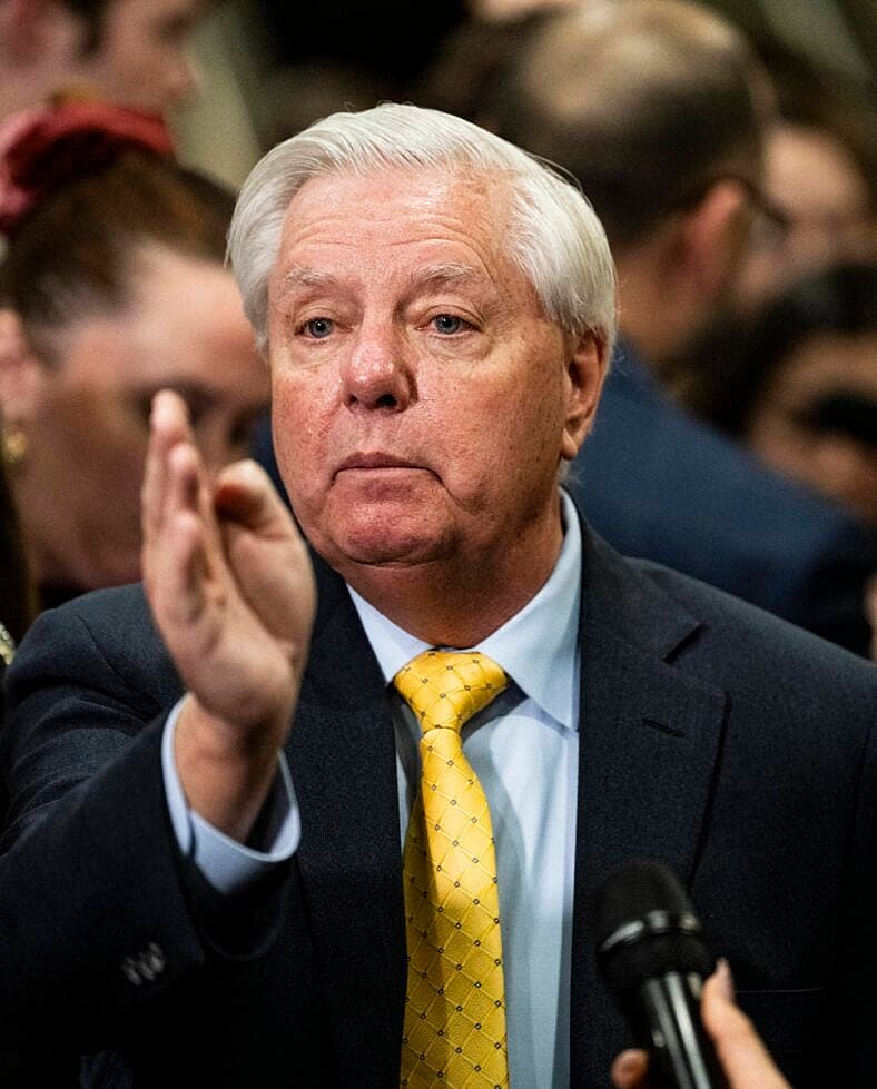 United States Senator Lindsey Graham (Republican of South Carolina) listens as Loretta Lynch, United States Attorney For The Eastern District Of New York