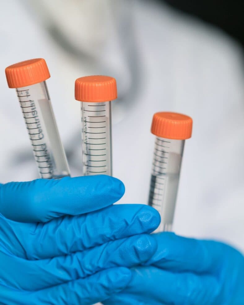 Man holding test tubes