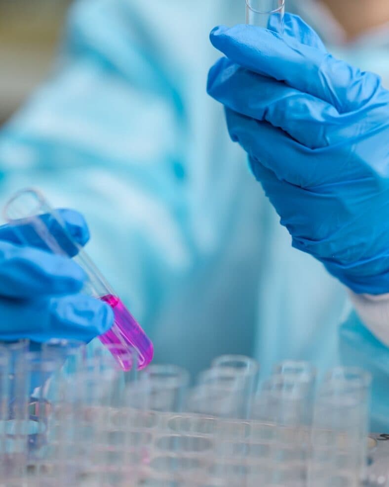 Man holding test tubes