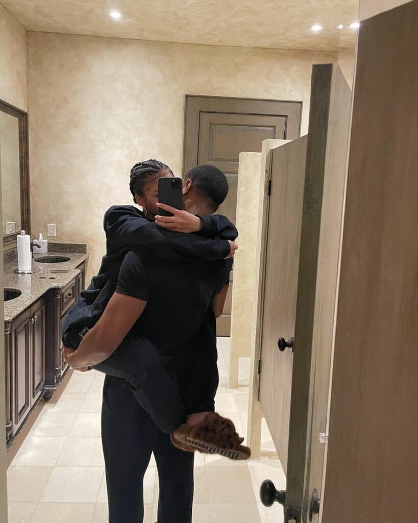 Michael B. Jordan carrying Lori Harvey.
