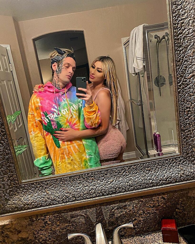 Aaron Carter and Melanie Martin posing for a selfie.