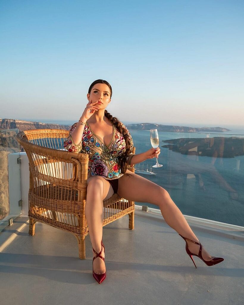 Demi Rose poses for the camera.