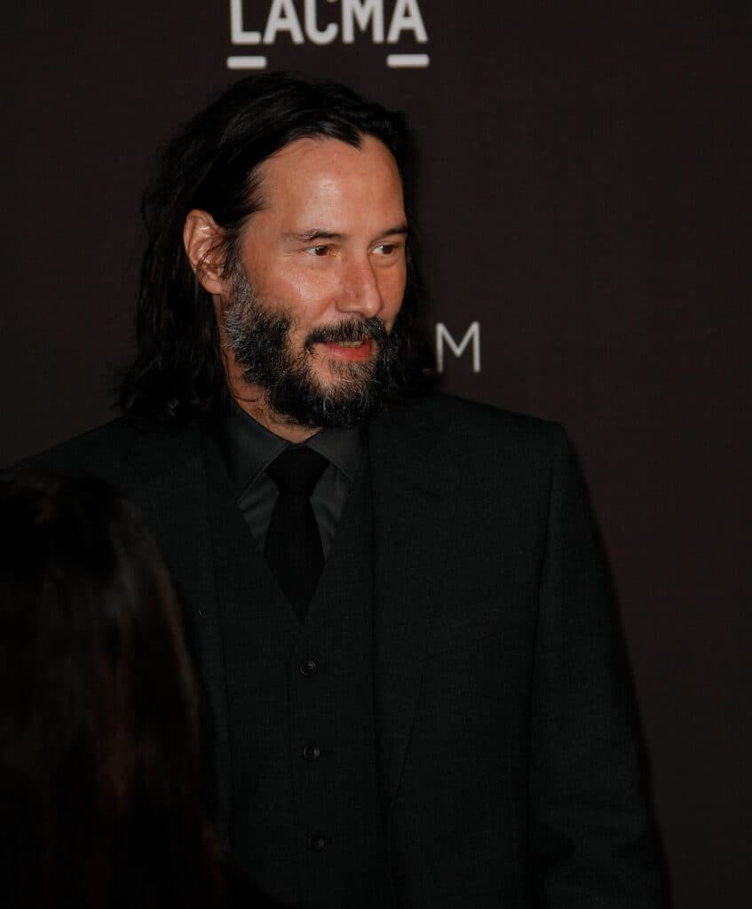 Keanu Reeves posing.