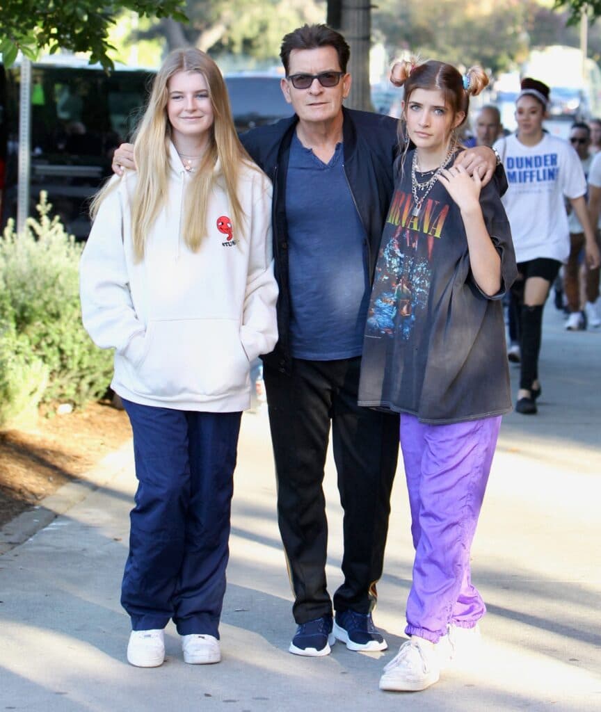 Charlie Sheen searched by security at the Billie Eilish concert and removes a clear container containing colored tablets
