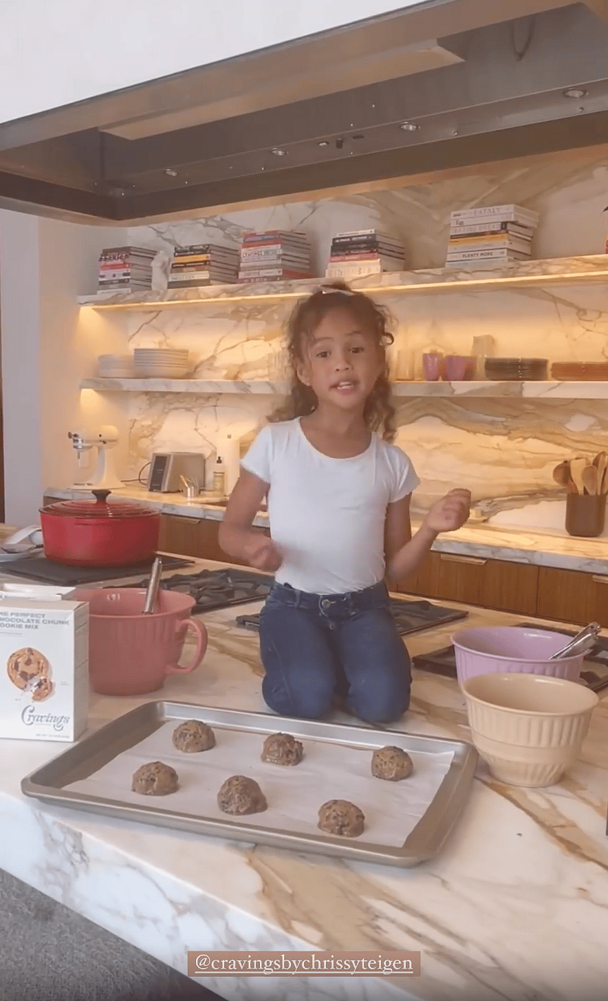 Chrissy Teigen's daughter Luna cooking