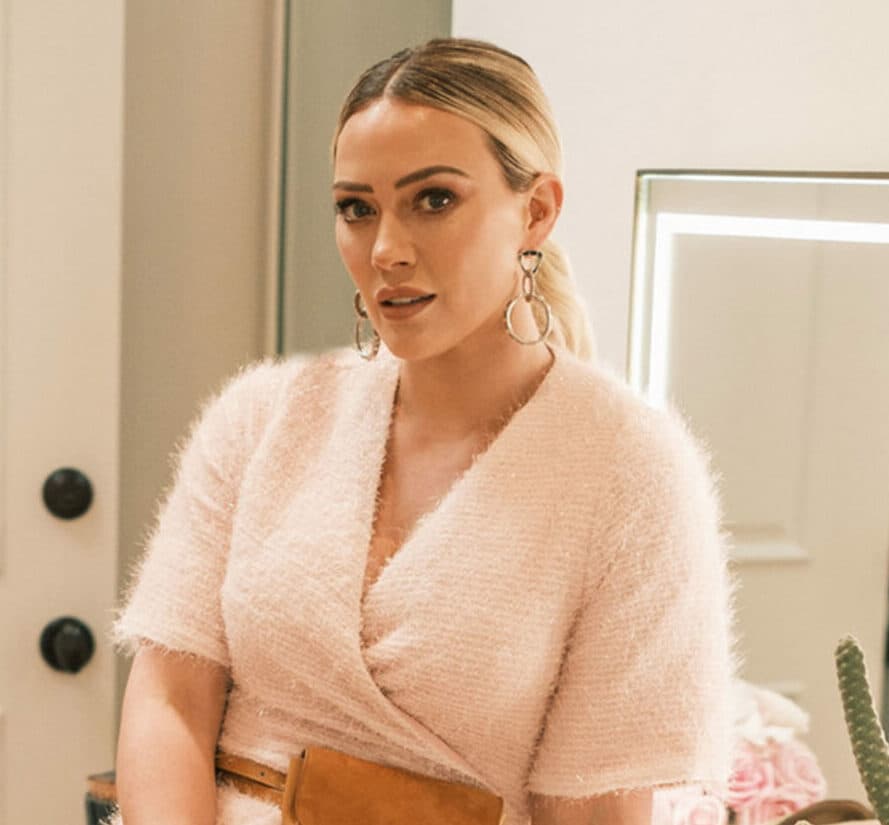 Hilary Duff shows off her shapely legs and dazzles in festive tinsel Smash Tess romper