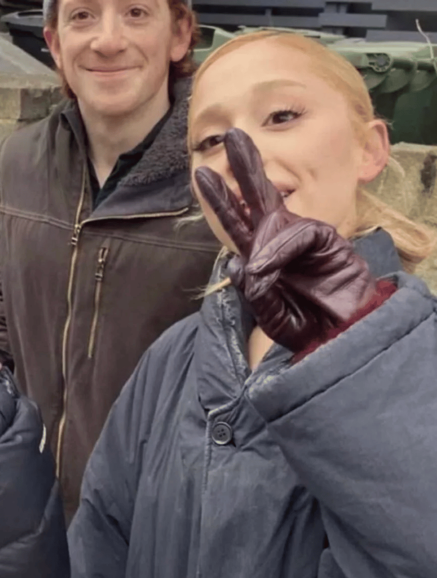 Ethan Slater and a woman posing together outdoors in winter clothing
