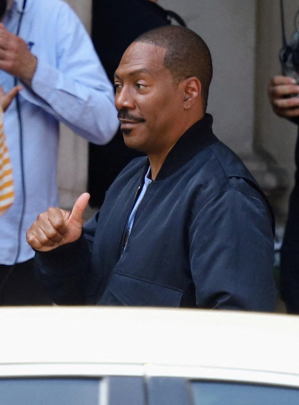 Eddie Murphy and cast shoot scenes for Beverly Hills Cop in "Axle F" film set