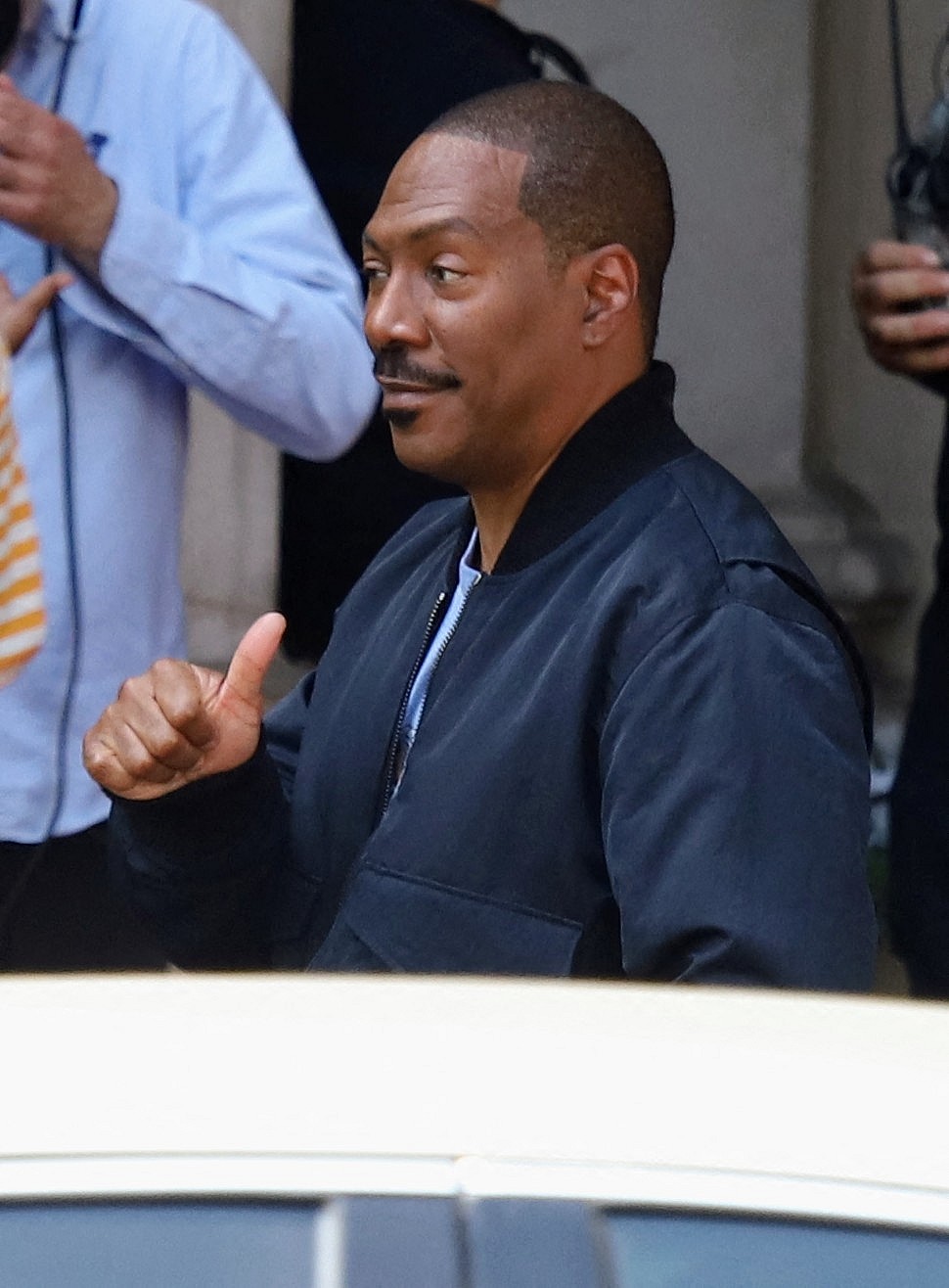 Eddie Murphy and cast shoot scenes for Beverly Hills Cop in "Axle F" film set