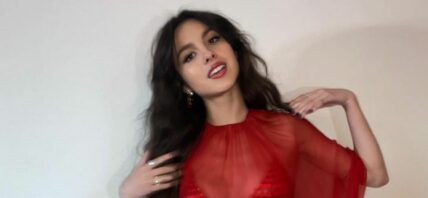 Olivia Rodrigo in a red shimmery dress