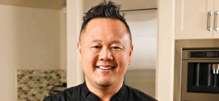 Chef Jet Tila holding food
