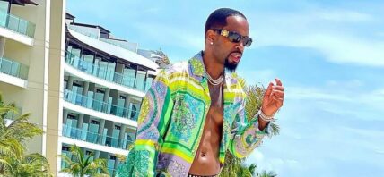 Safaree in a green Versace suit