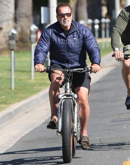 Arnold Schwarzenegger biking in Venice Beach after leaving GoldS Gym