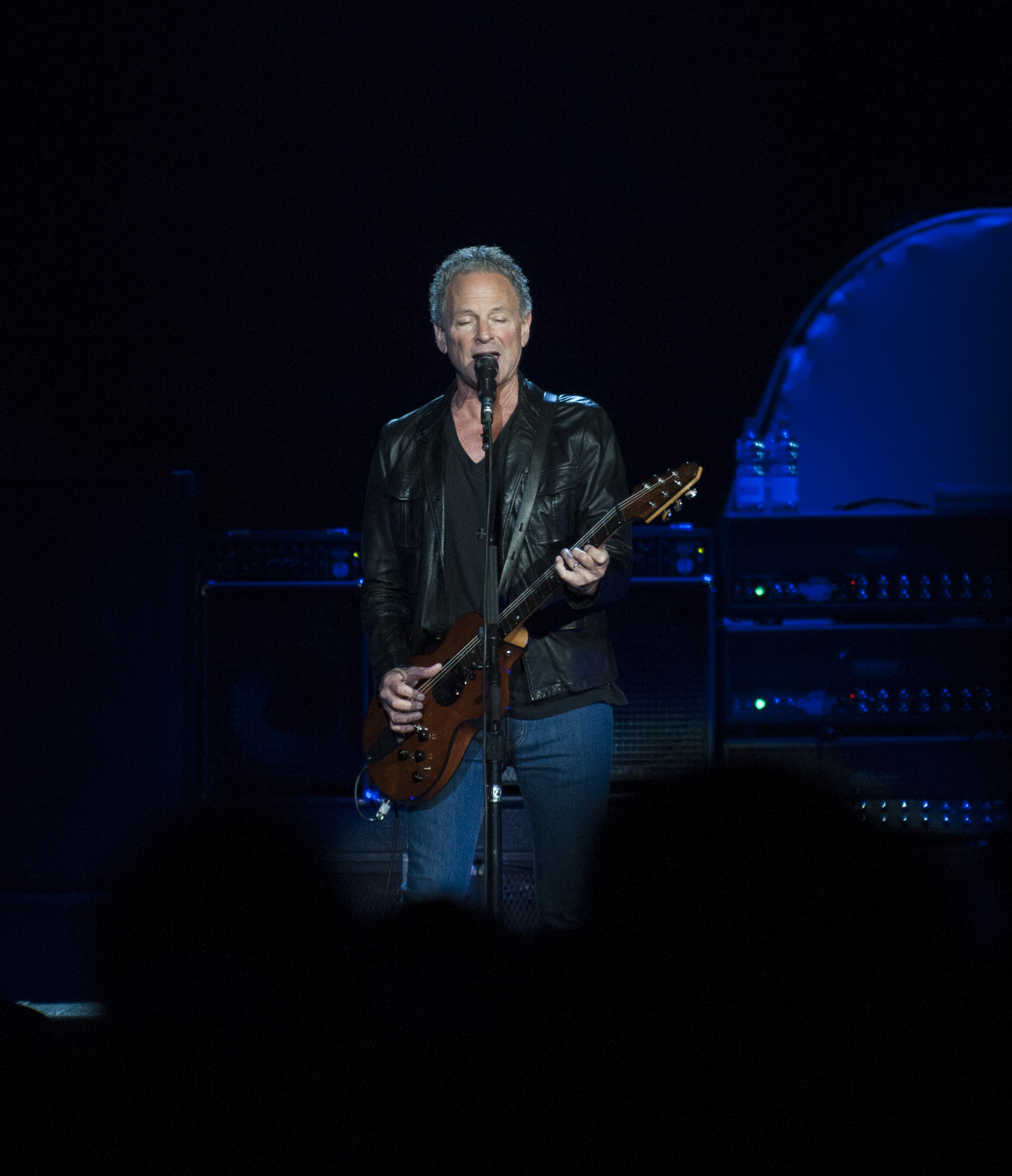Fleetwood Mac performing at the Phones 4u Arena, Manchester, England on 1st October 2013. Singer / guitarist Lindsey Buckingham.