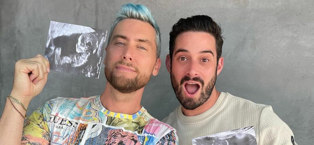 A photo showing Lance Bass and his husband, Michael Turchin, holding their kids' sonogram