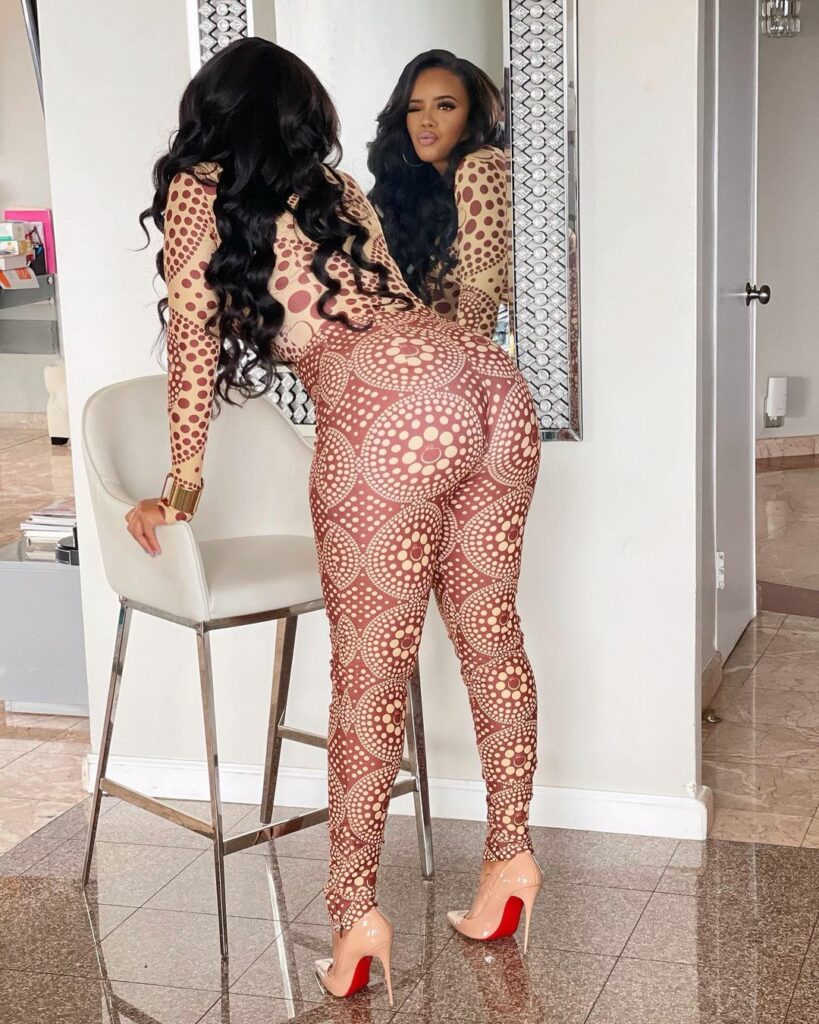 Angela Simmons in a brown bodysuit.