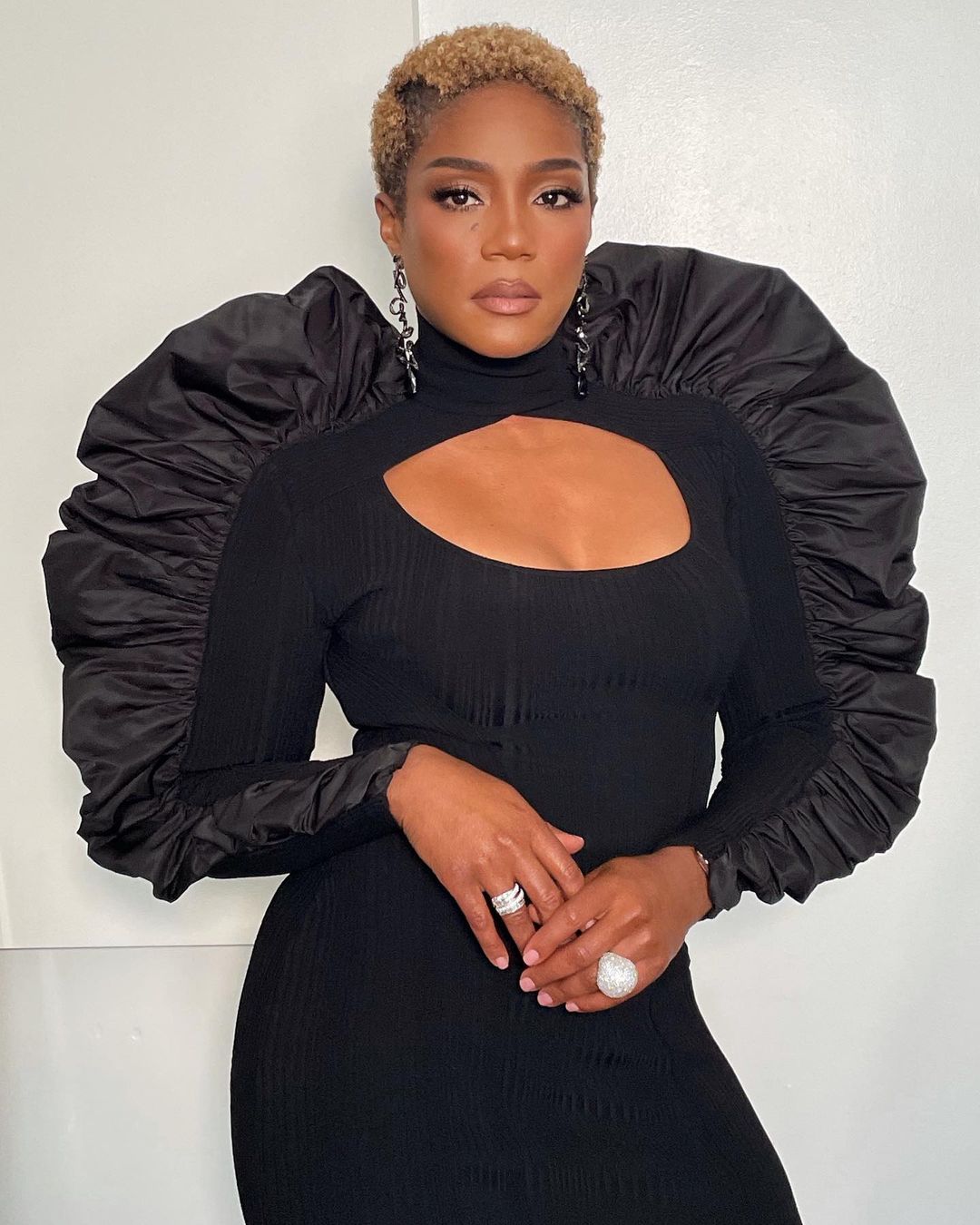 A photo showing Tiffany Haddish in a sizzling black dress.