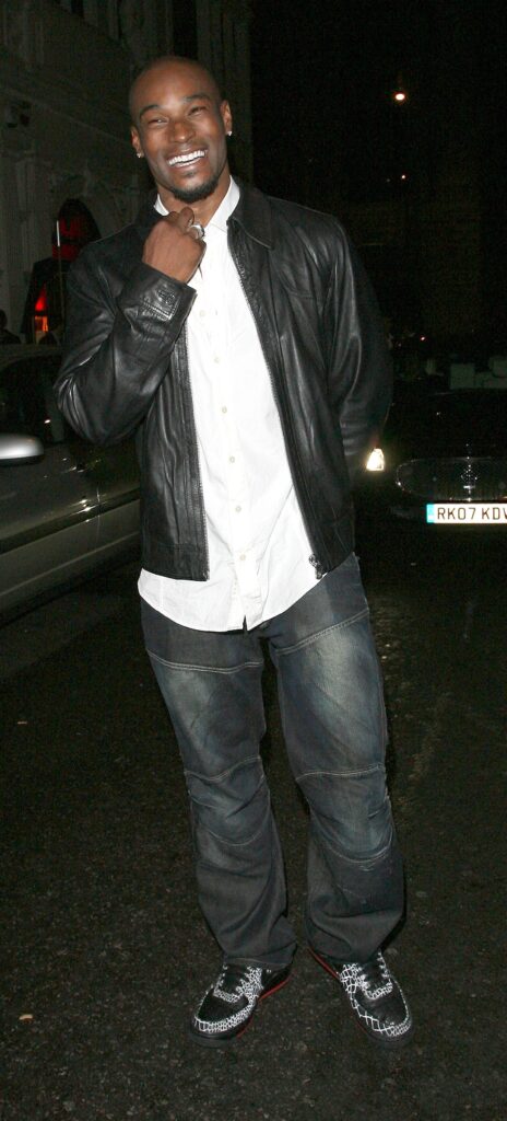 Tyson Beckford and a female companion leaving Mahiki nightclub