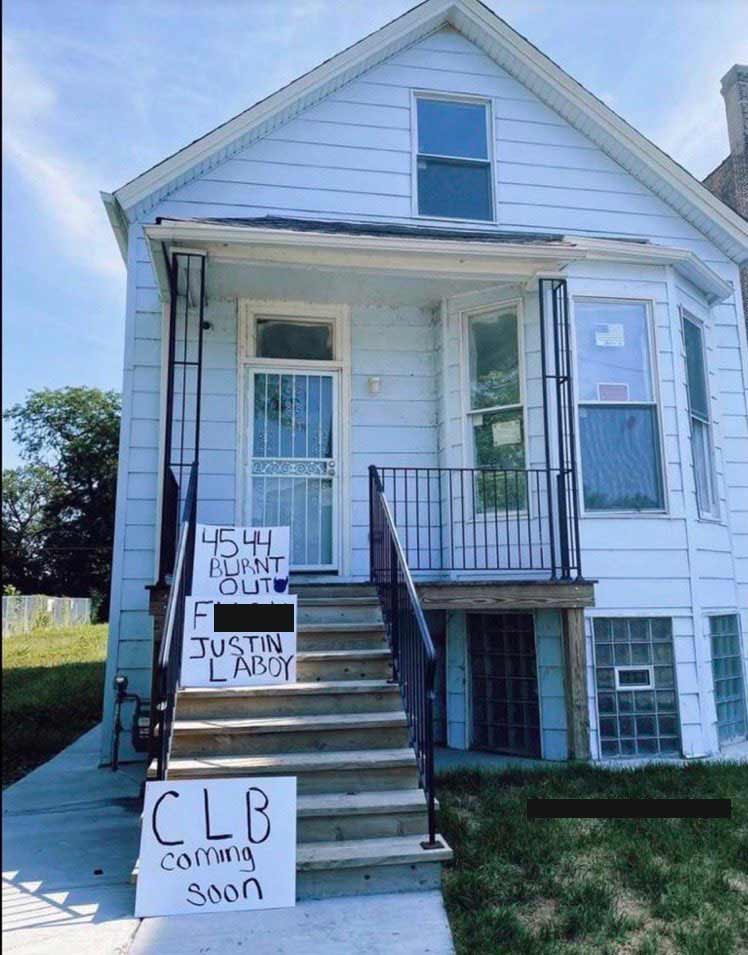 Drake fans leave signs at Kanye's childhood home.