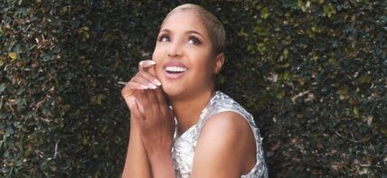 A lovely photo showing Toni Braxton in a shiny outfit.