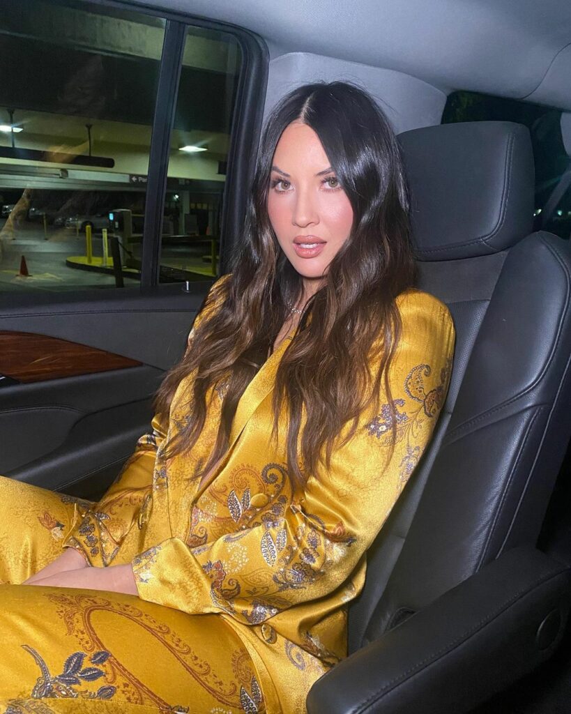A photo showing Olivia Mulaney in a yellow print oufift.