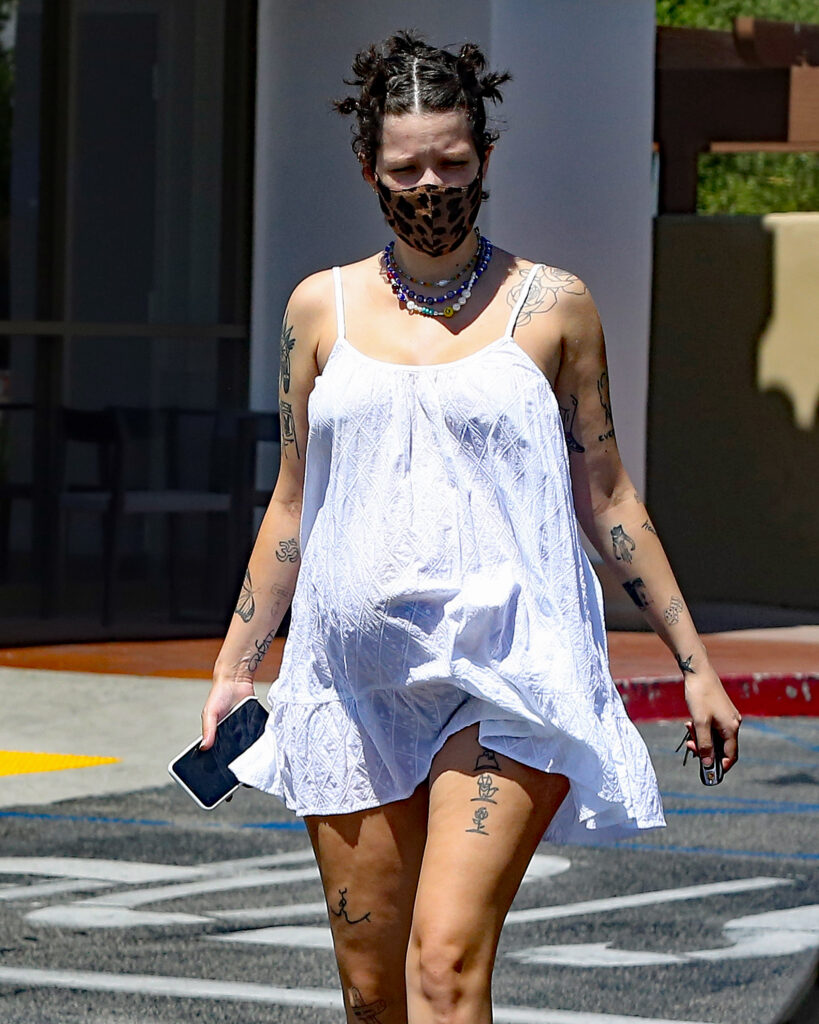 Pregnant Halsey heads tp starbucks wearing a leopard face mask and baby blue cowboy boots