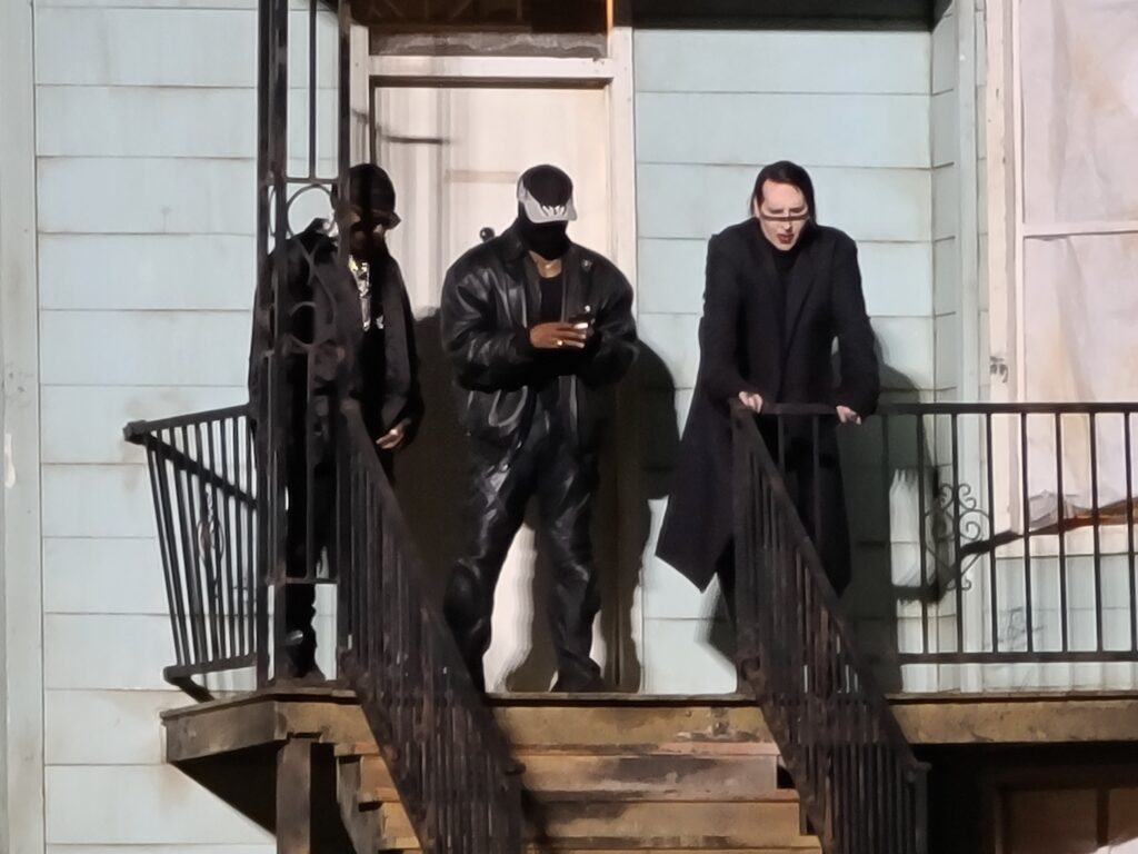Marilyn Manson and Kanye West hang out on stage of a replica house of Kanyes late mother Donda in Chicago